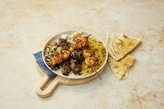 Mezze plus charcoal chicken and grilled skewers with rice and salads