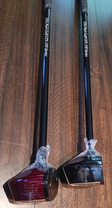 Two USA Park Golf GT3-350 Series clubs on wooden floor.