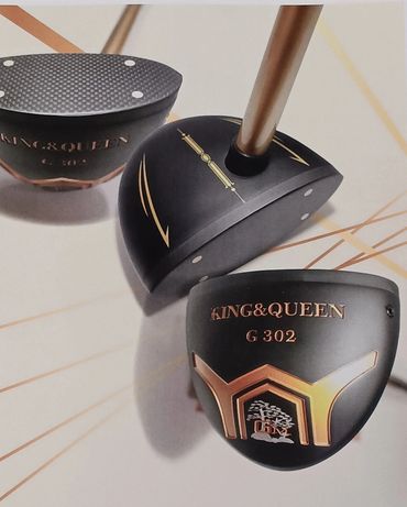 Close-up of King & Queen G 302 golf club heads with black and gold design.