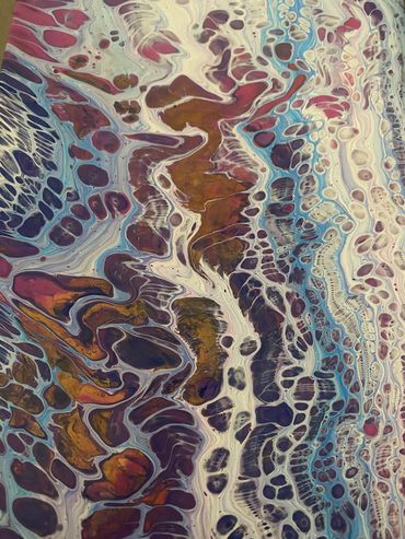 Abstract fluid art painting with swirling patterns and vibrant colors.