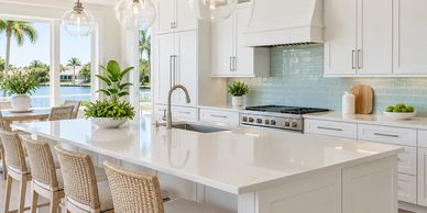Bright modern kitchen with island and stools.