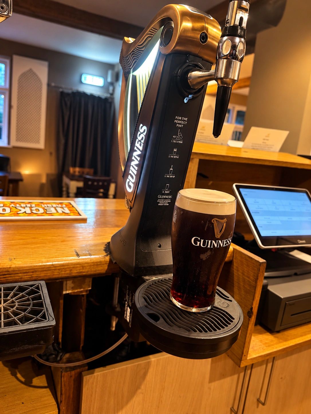 A perfectly poured pint at the bar