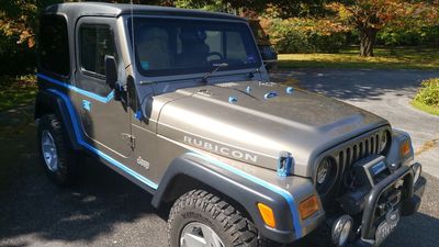 Jeep Wrangler carefully masked during Preservation Recon preparation, protecting trim, seals, and hi