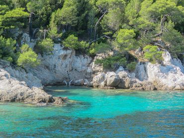 The water in a cove, many colors of blue.