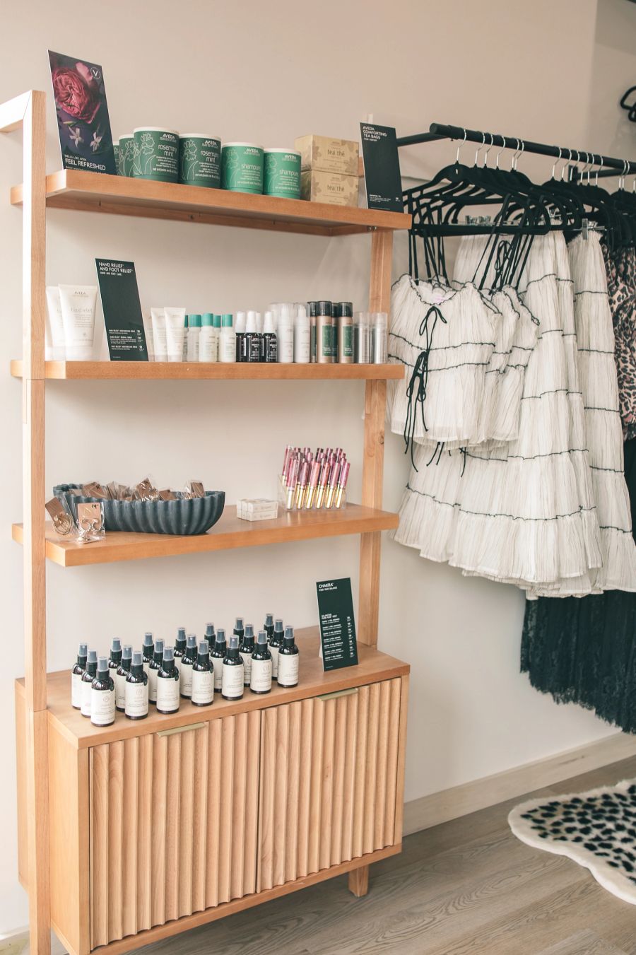 Aveda products and boutique apparel on display