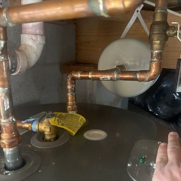 Local plumber clearing a clogged drain with professional equipment in a Mount Juliet home.