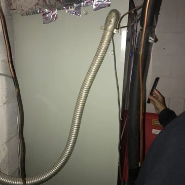 Installation of a modern tankless water heater system in a Mount Juliet, TN home.