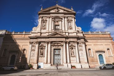 A grand historic church facade under a clear blue sky.