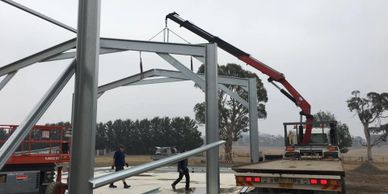 Rusty Nuts Towing & Hiab lifting a shed frame