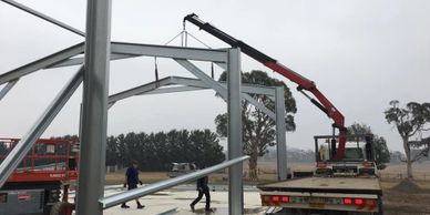 Rusty Nuts Towing & Hiab lifting a shed frame