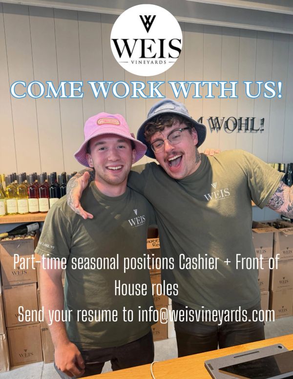 Two smiling employees promote job openings at Weis Vineyards.