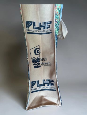 A beige bag with Prince Lot Hula Festival and MGF Hawai'i logos.