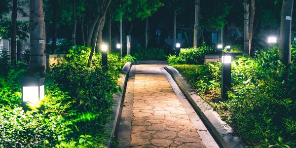 Outdoor walking path at night light by LED light fixtures.