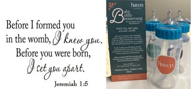 A biblical quote on the left and baby bottles with a card on the right.