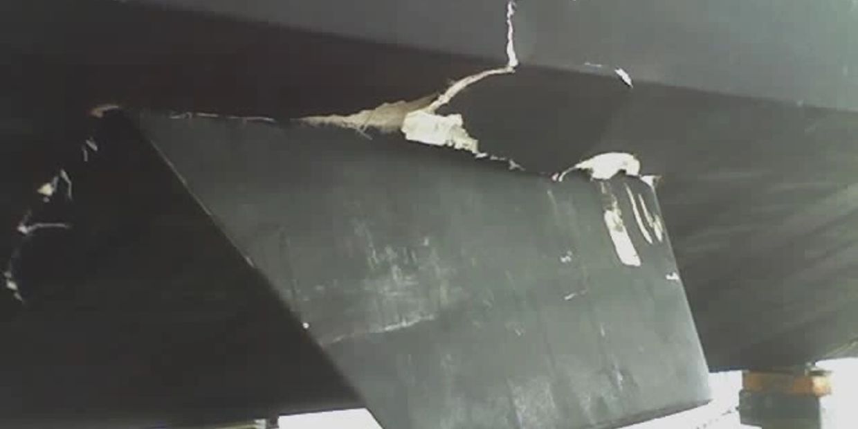 Hull and machinery damage on a fibreglass hull. Stabilizer fin penetrated the hull. 