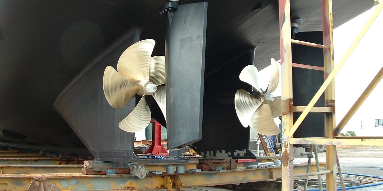 Propellors and underwater machinery on large super yacht on the slipway. 