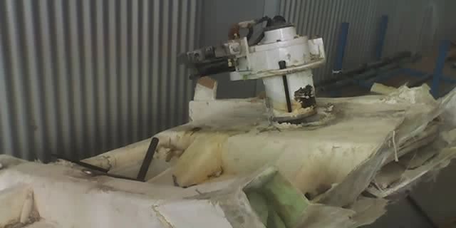 Hull damage being assessed due to a stabilizer fin impact and hull failure