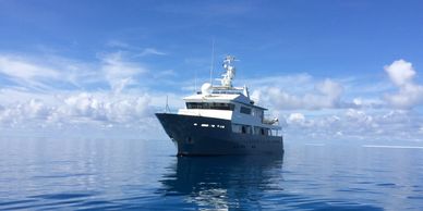 Motor yacht on anchor at Pioneer Bay Airlie Beach 