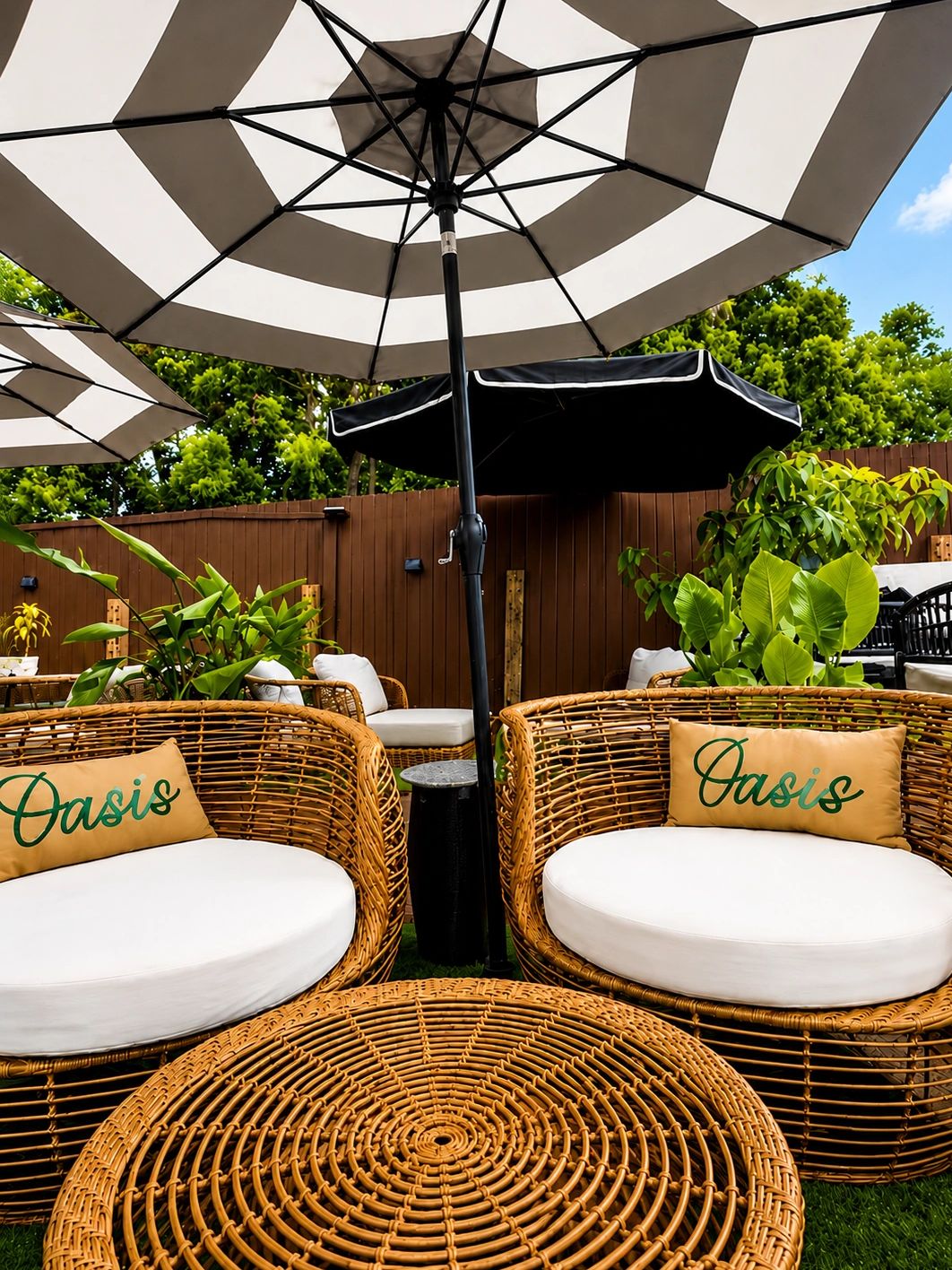 Cozy outdoor seating with wicker chairs and umbrellas.