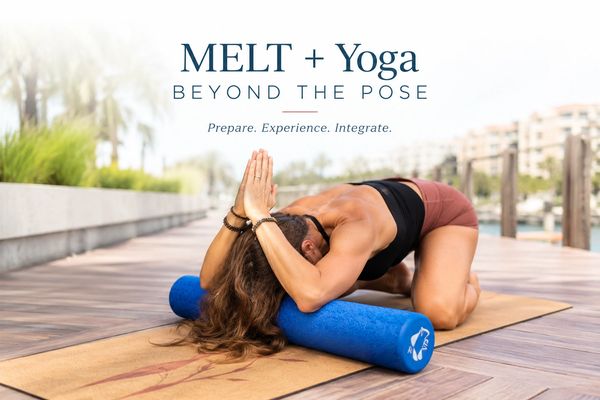 Woman practicing MELT and yoga with foam roller outdoors.