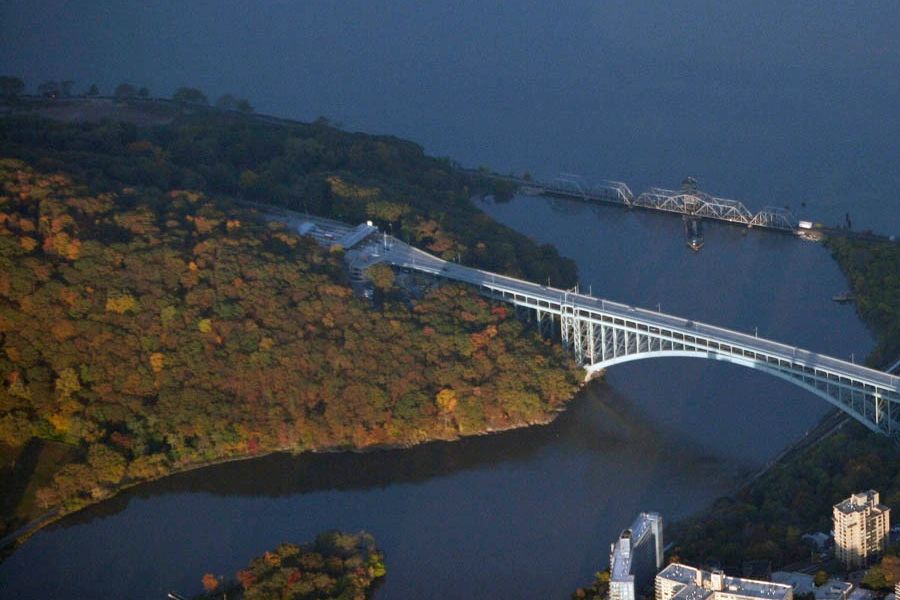 Flyover image of Henry Hudson Bridge and nearby wooded hill