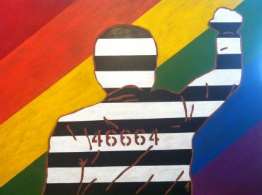 Silhouette of prisoner raising fist against a rainbow background.