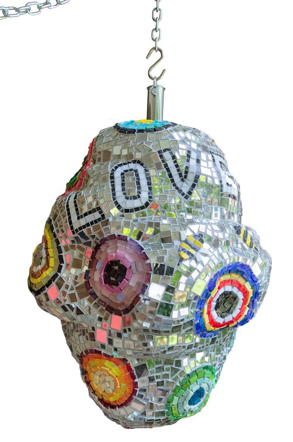 Colorful mosaic lamp with the word LOVE.