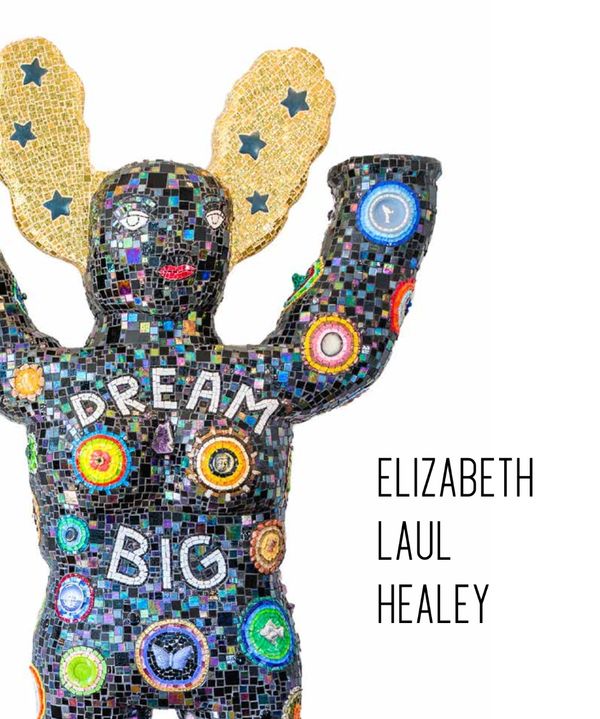 Colorful mosaic sculpture with DREAM BIG text.
