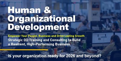 A business training session on Human &amp; Organizational Development with employees in a conference setting.