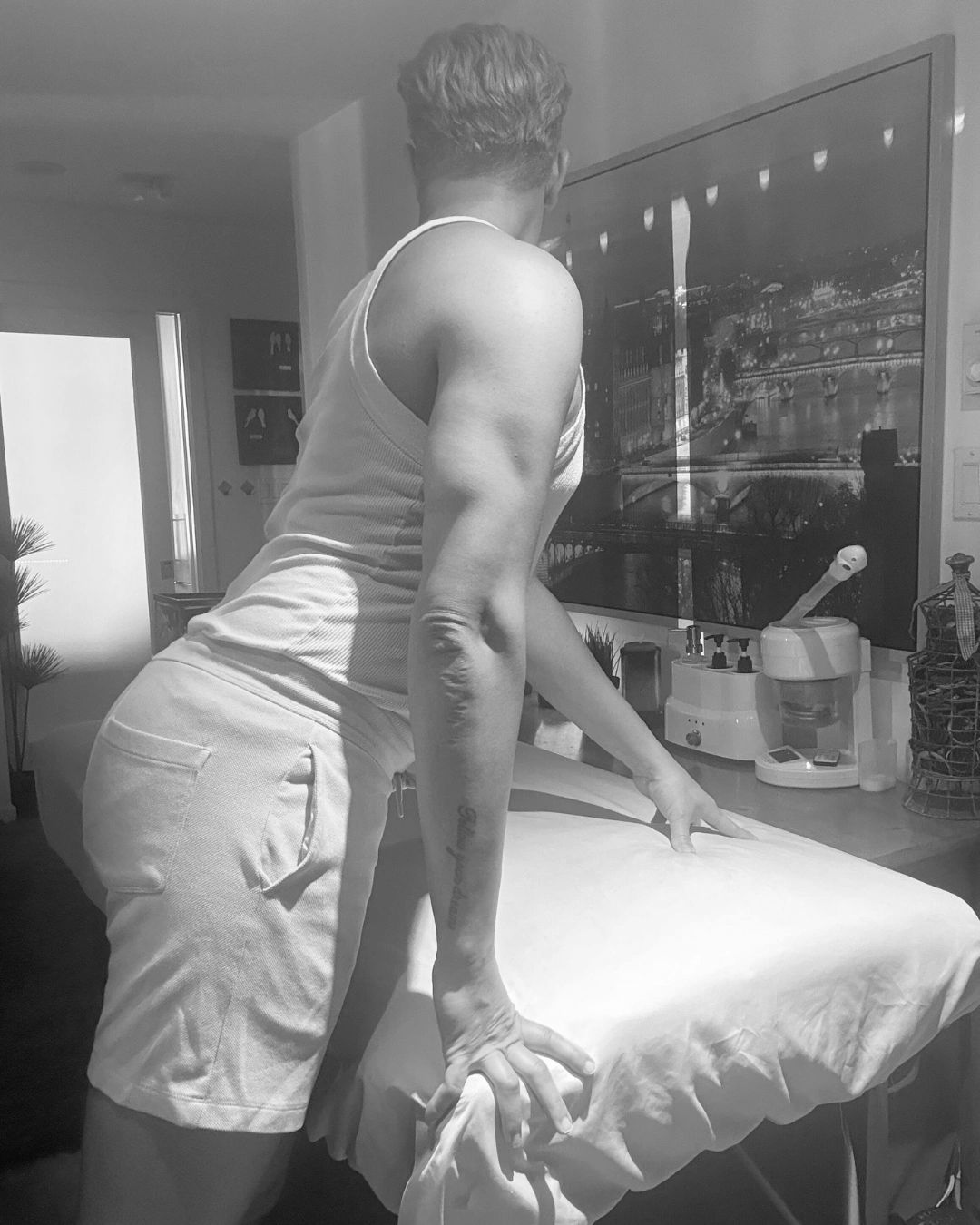 A man is preparing his massage table for servicing