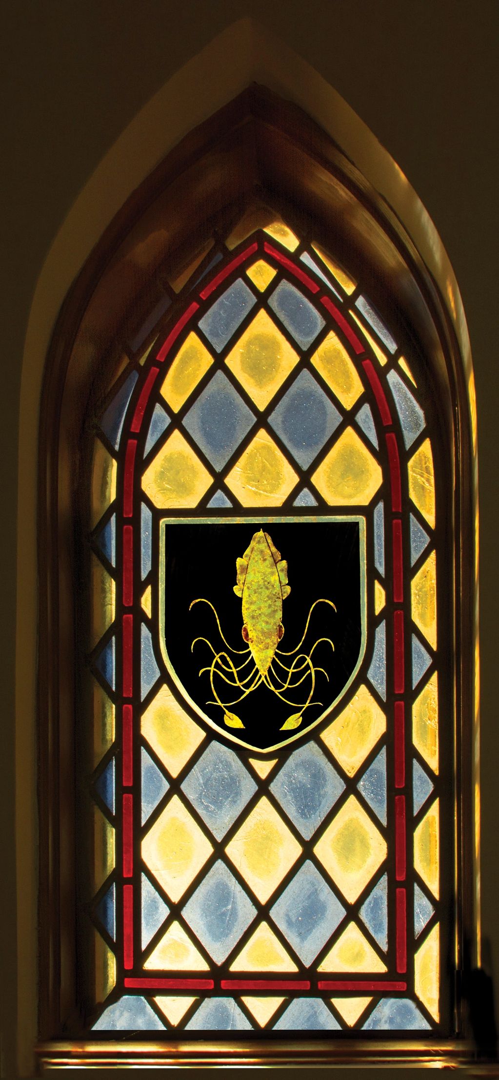 Golden  Kraken on a black field in the center of sigil