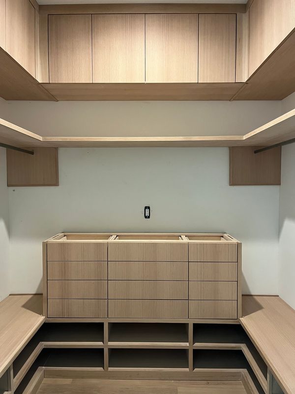 Rift sawn white oak closet cabinetry with base cabinet