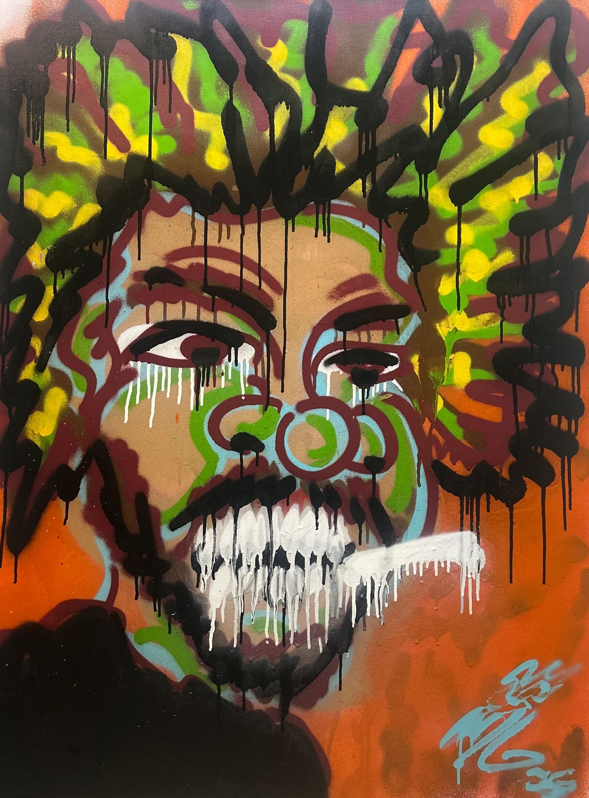 Colorful graffiti of a face with dripping paint and a wide smile.