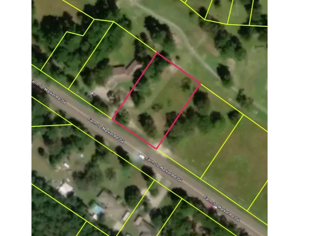 Aerial view of a neighborhood with property boundaries marked.