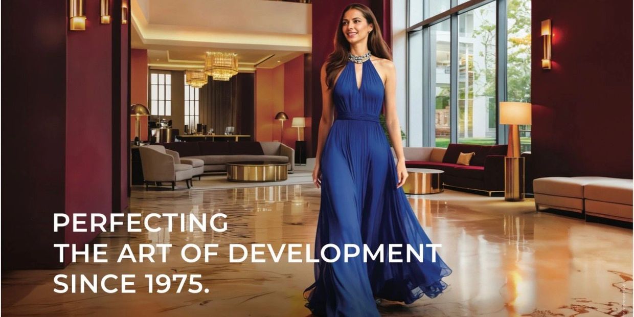 Elegant woman in blue dress walking inside a luxurious modern lobby.