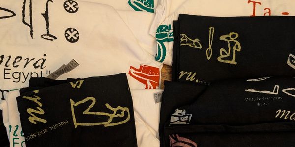 8 Medium and Large T shirts, each hand printed, completely unique, and hand numbered.