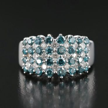 Silver ring with blue and white stones.