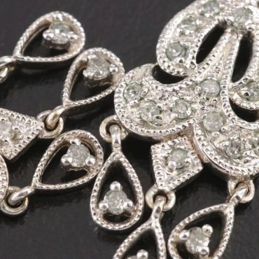 Close-up of silver diamond-studded jewelry.