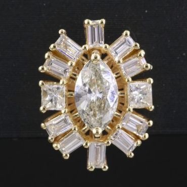 Gold ring with marquise and baguette diamonds.