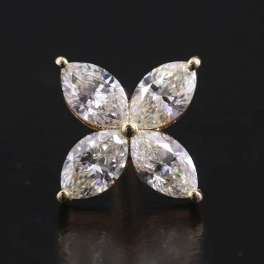 Diamond earrings shaped like four leaves.