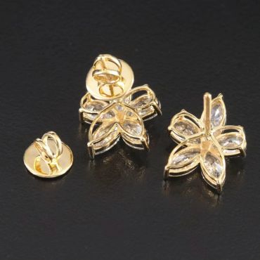 Gold butterfly-shaped earrings with clear stones.
