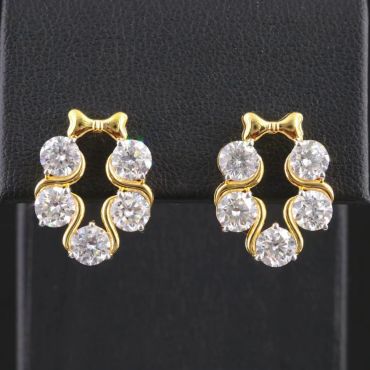 Elegant gold earrings with clear gemstones.