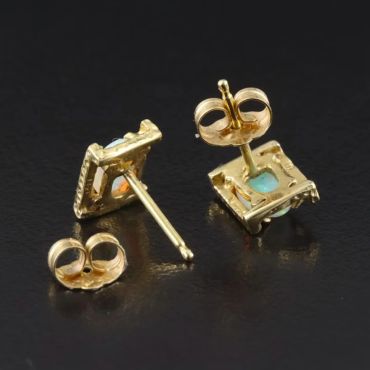 Gold stud earrings with square turquoise stones.