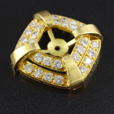 Gold and diamond studded jewelry piece.