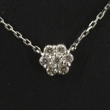 Diamond flower pendant on a silver chain.