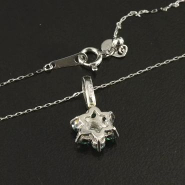 Delicate silver necklace with a snowflake pendant.