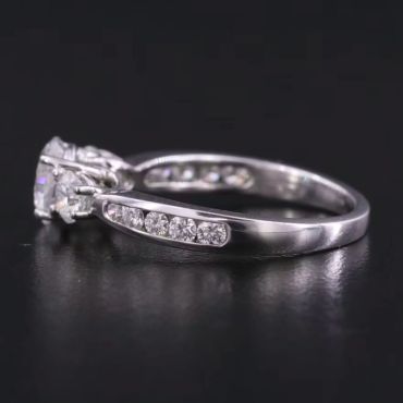 Elegant silver ring with small diamonds embedded in the band.