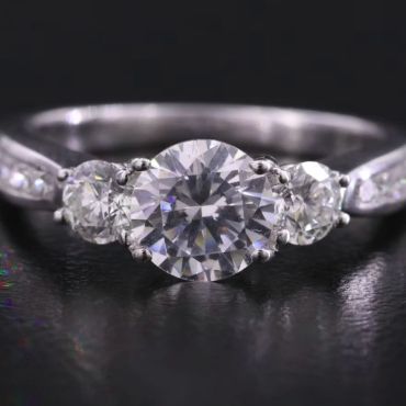 Close-up of a three-stone diamond ring.