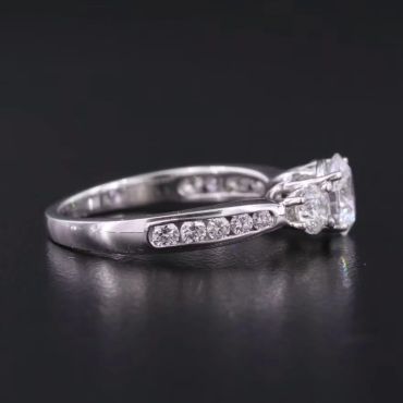 Elegant diamond engagement ring with side stones.