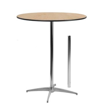 Round table with a chrome base and removable leg.